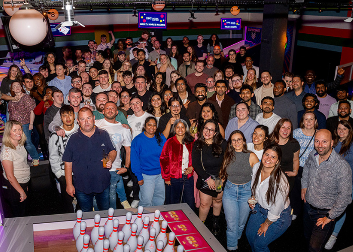 Colleagues enjoying a social night at Yuno Energy