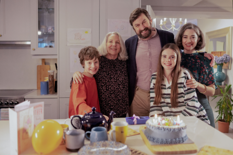 Family in their kitchen celebrating a birthday