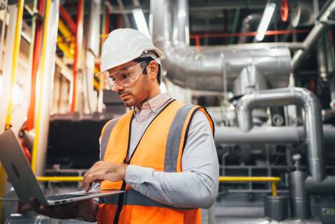 Man doing maintenance in a heat plant 